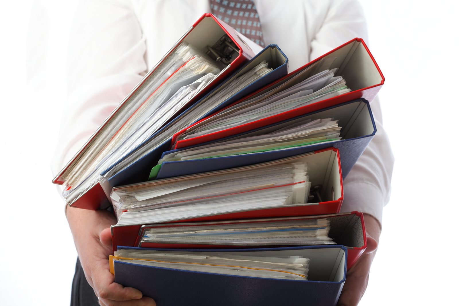 Man Holding Stack Of Folders